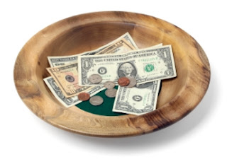 tithing plate with money